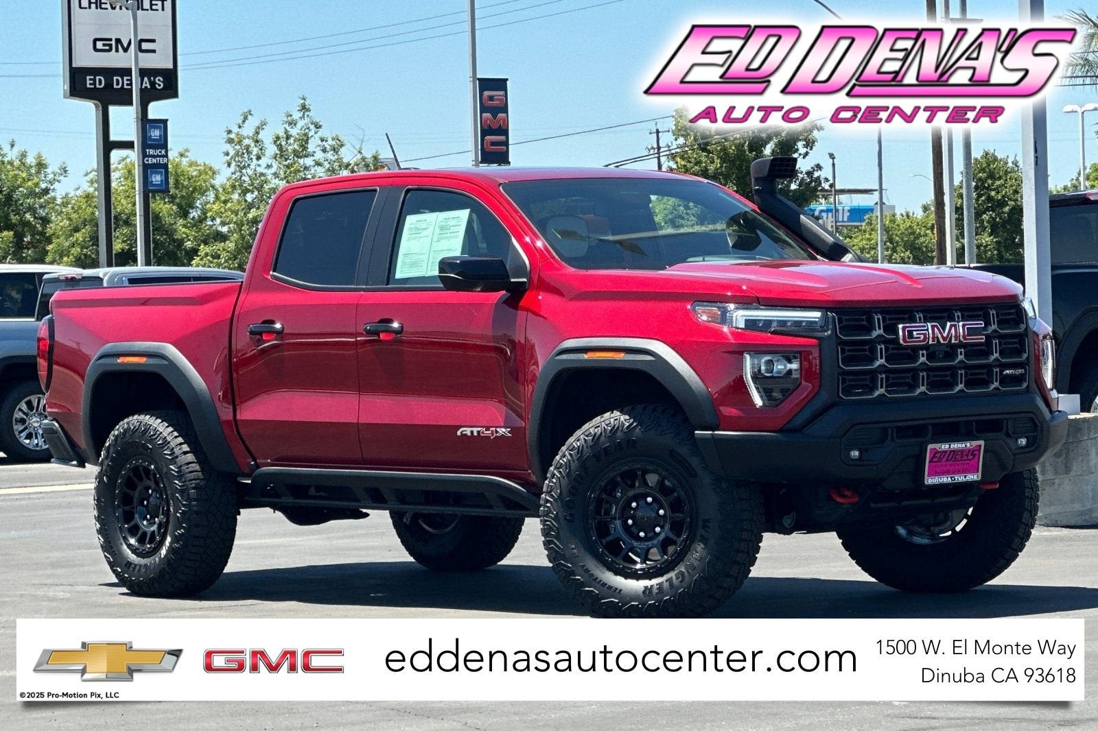 2026 GMC Canyon AT4X in Volcanic Red Tintcoat — front three-quarter view